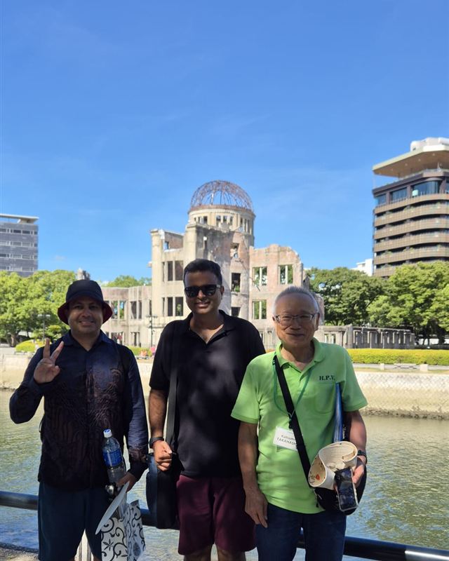 Varun at the Atomic Bomb Dome, Hiroshima, with a local guide